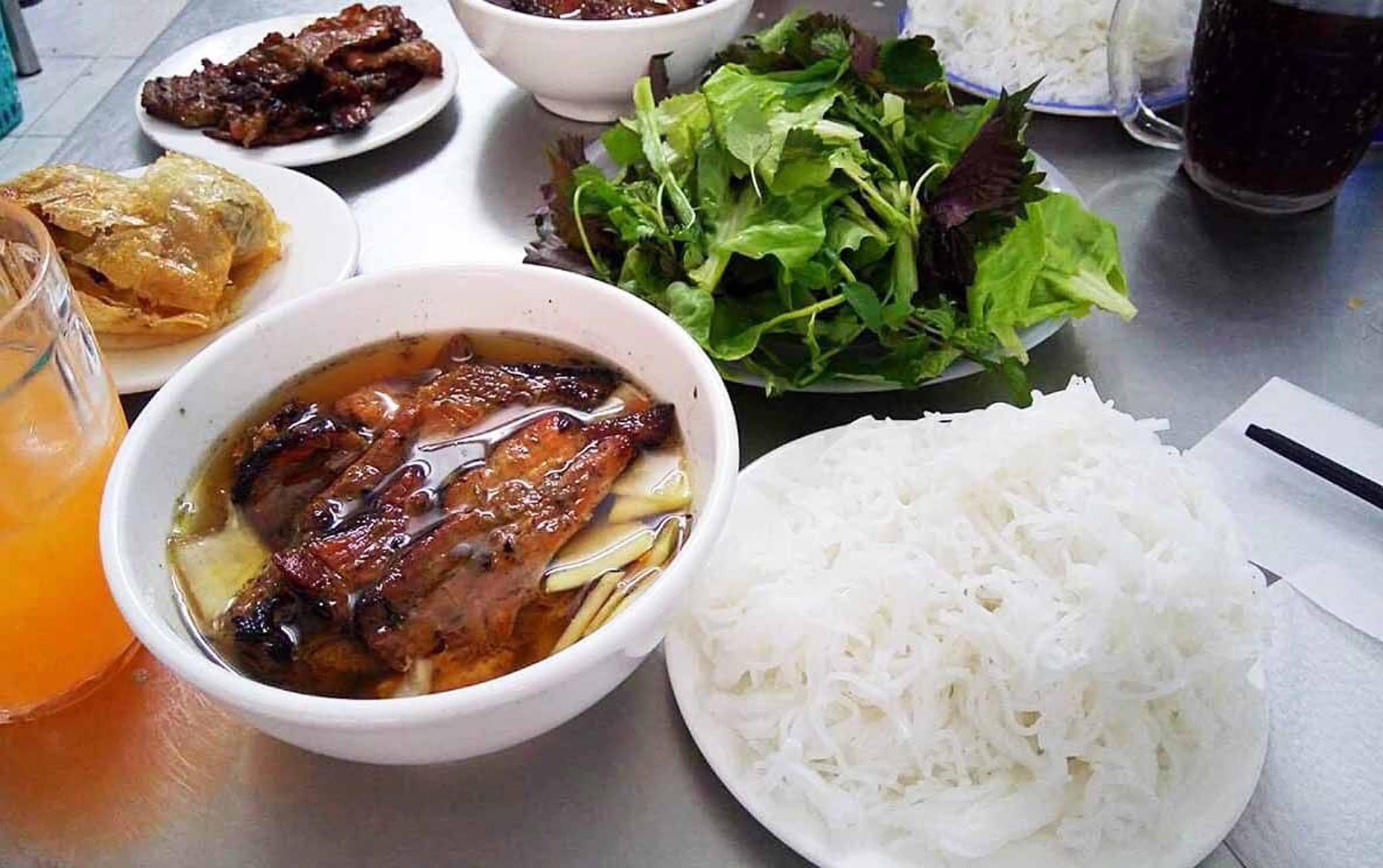 Bun Cha Huong Lien is famed for its flavorful grilled pork and sauce