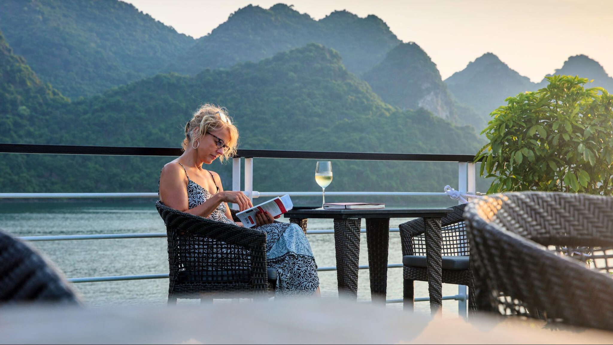 Have a cocktail on board while enjoying Halong scenery