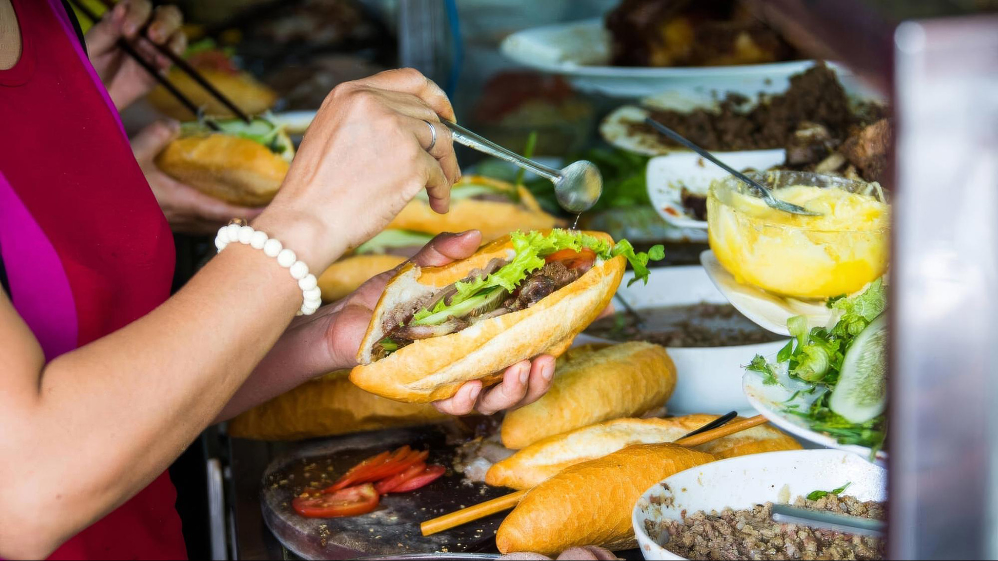 Banh Mi offers a perfect blend of crispy bread, savory meats, and fresh herbs