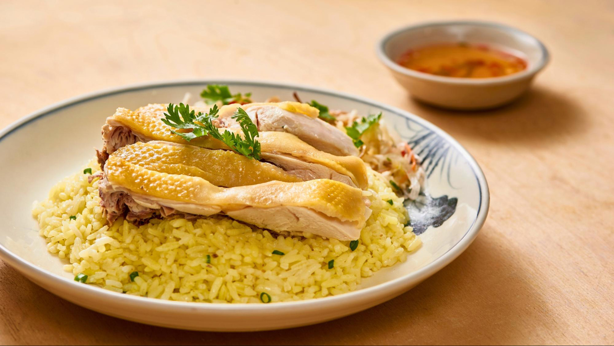 Com Ga delights with tender chicken, fragrant rice, and fresh herbs