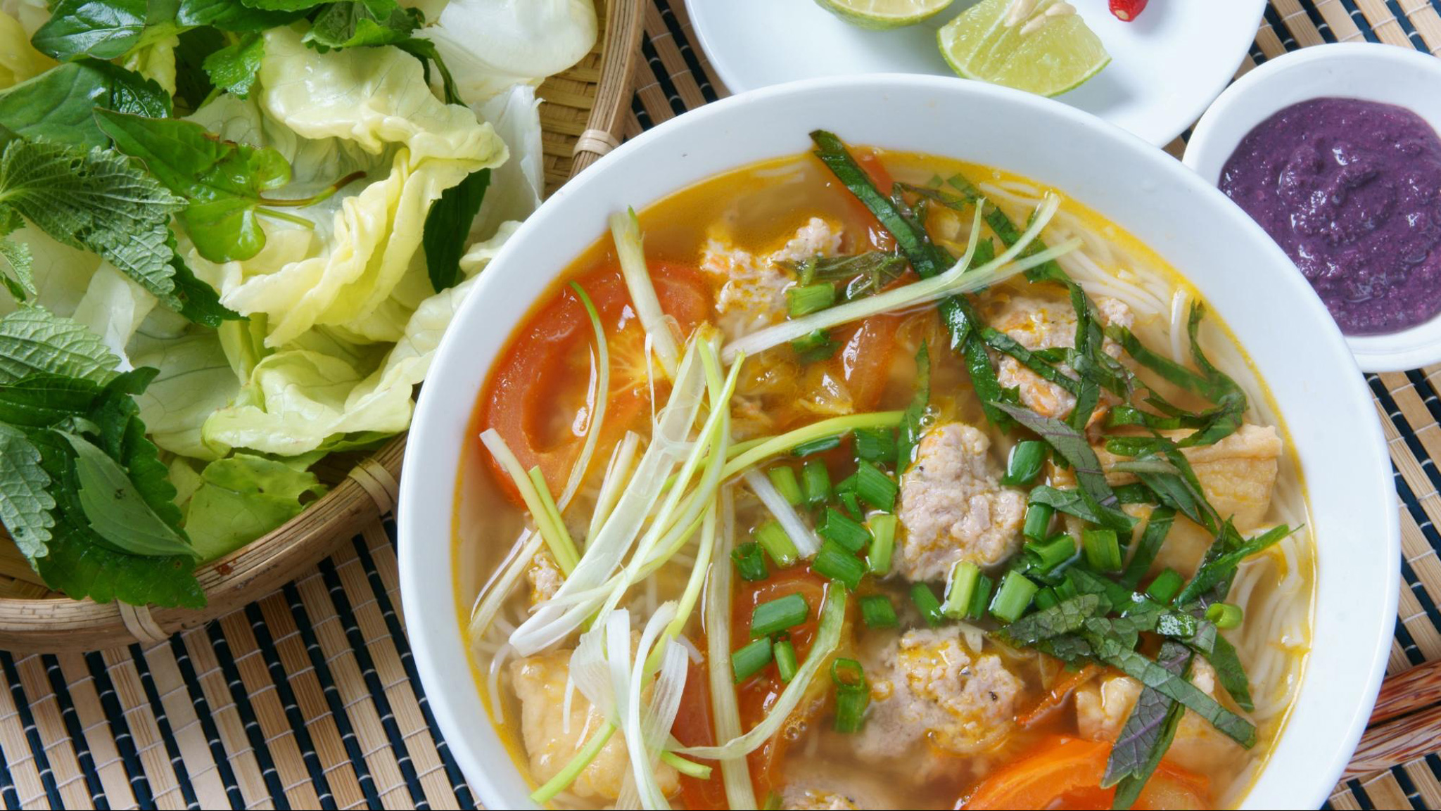 Bun Rieu bursts with tangy broth, fresh crab, and soft noodles