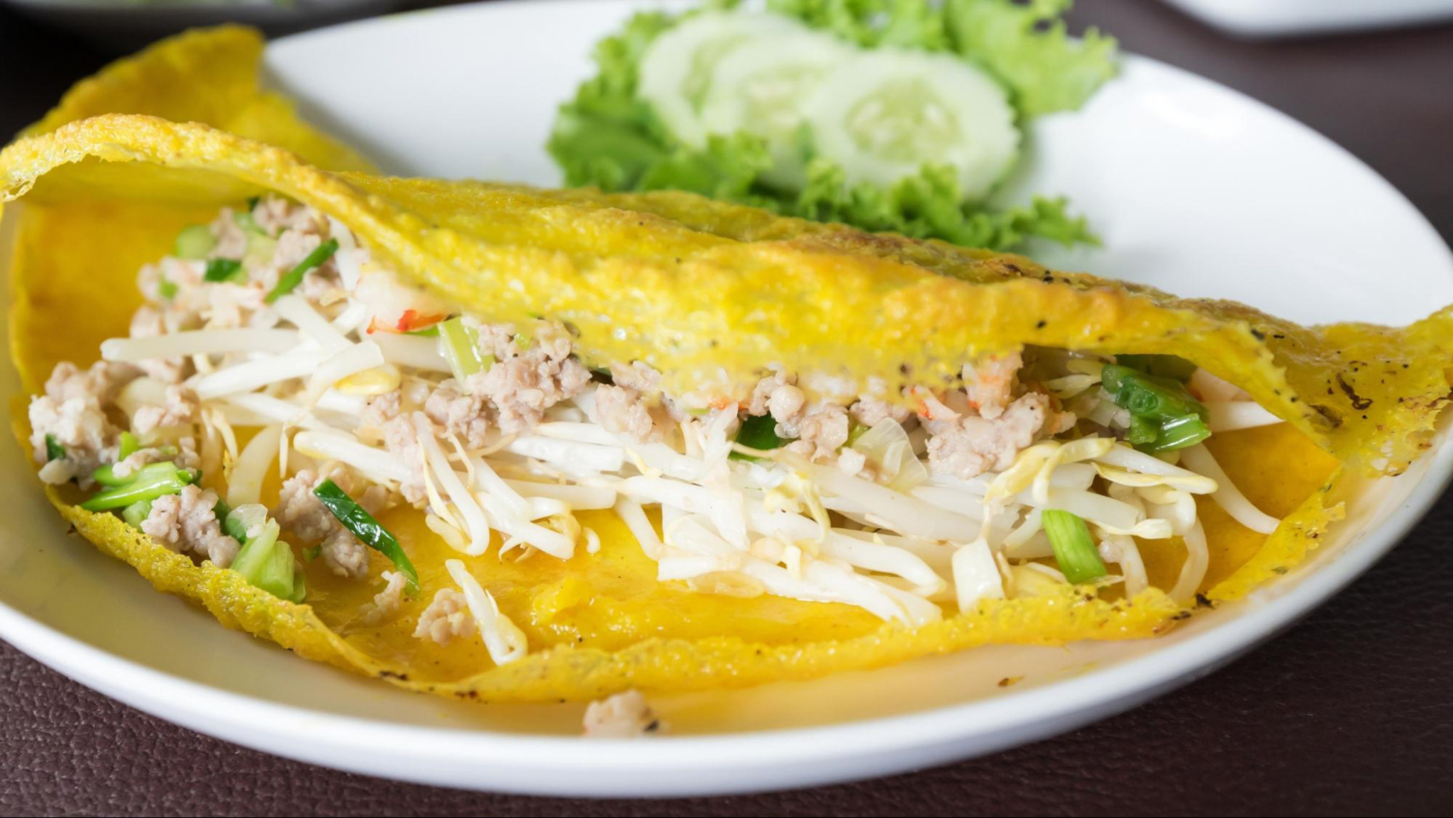 Delicious Banh Xeo must be crispy and golden before being rolled up