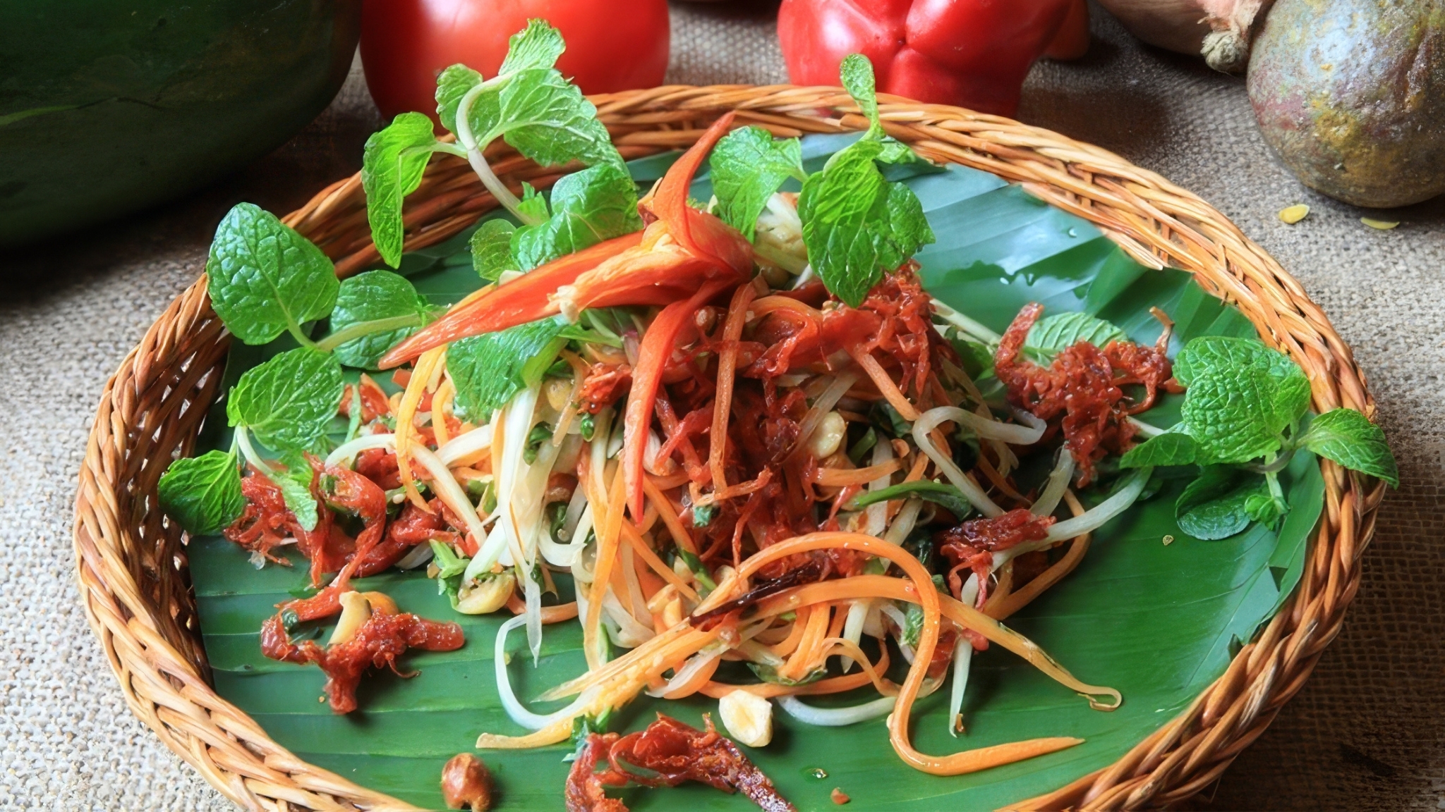 Green Papaya Salad Is A Fresh, Tangy Dish Featuring Shredded Papaya, Herbs, Chili, And A Flavorful Dressing
