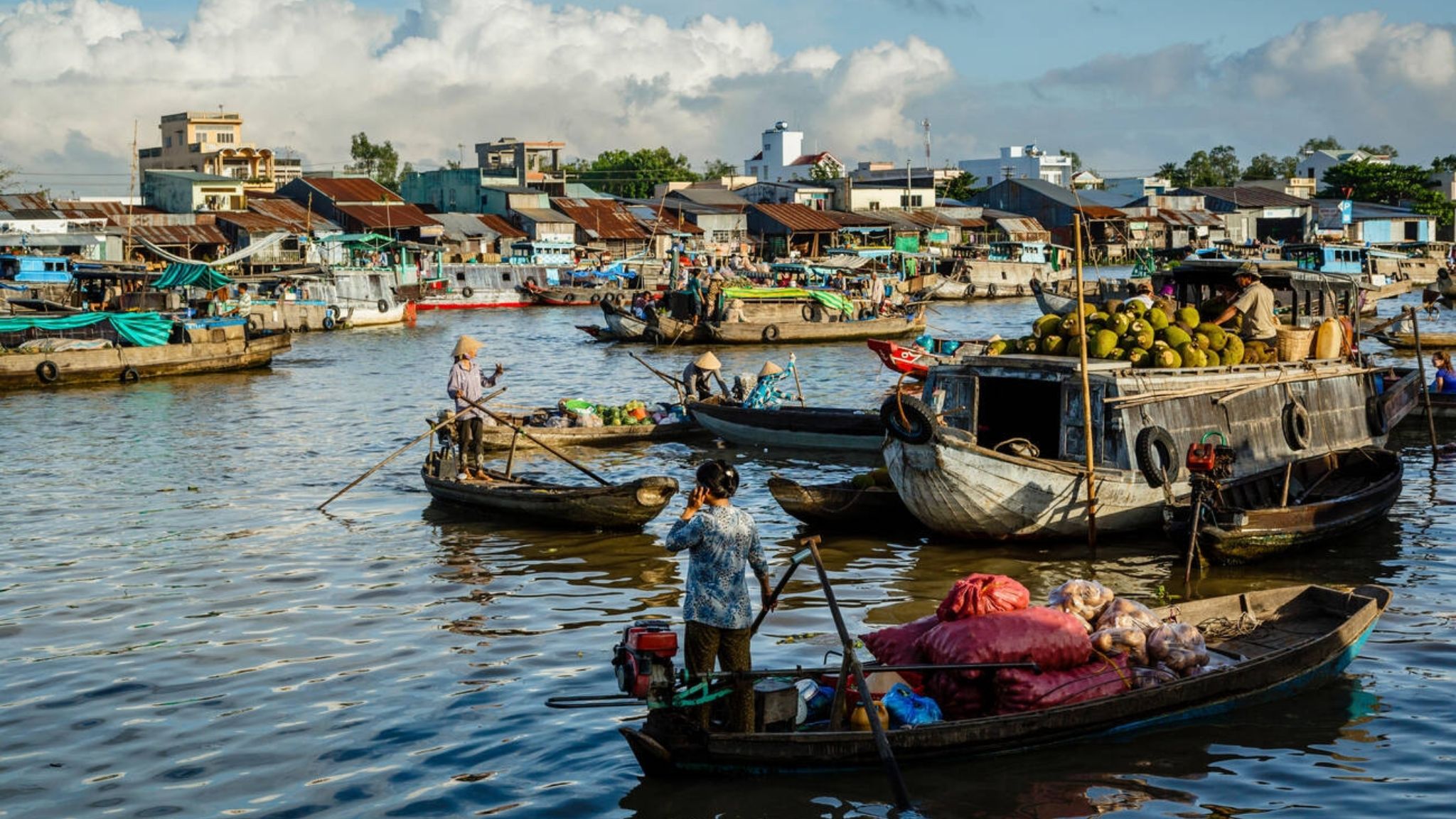 The Floating Market In Mekong Delta Is Unique, With Boats Selling A Variety Of Fruits And Vegetable