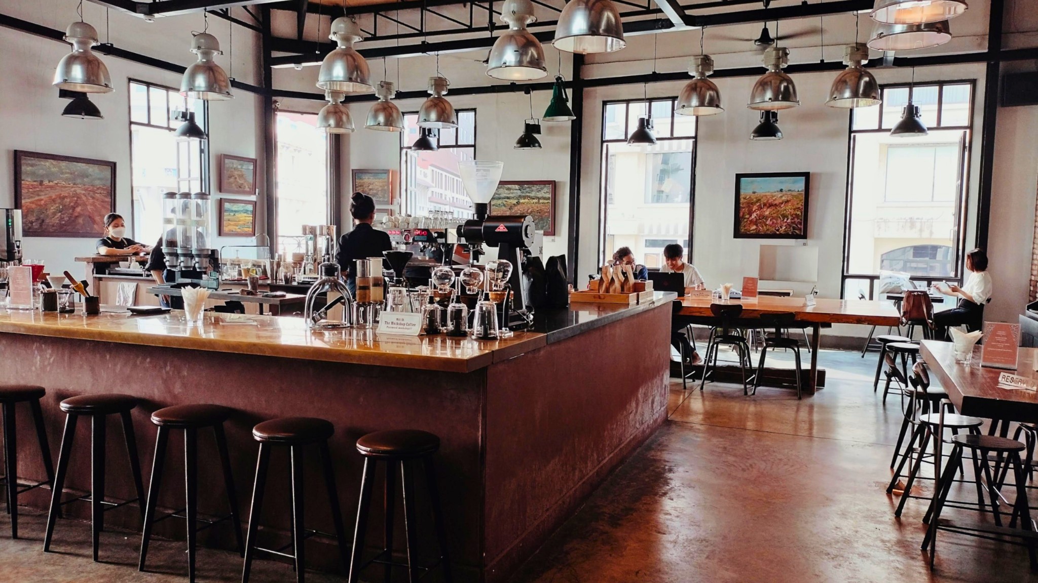 At the coffee shop, you can enjoy a drink, read, listen to music, or watch the bustling street life