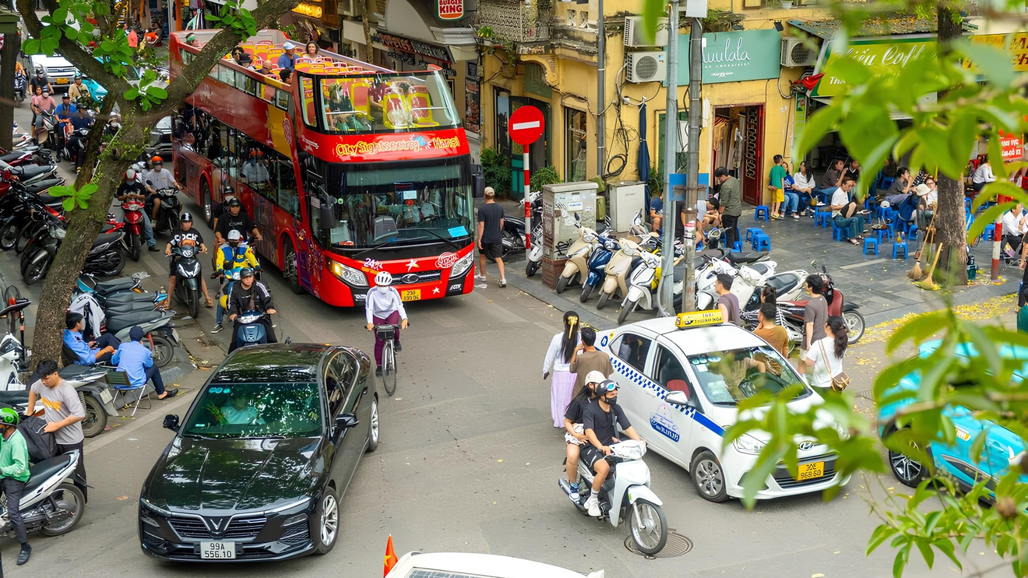 A ride on a double-decker bus offers a scenic and stress-free way to see Hanoi’s highlights