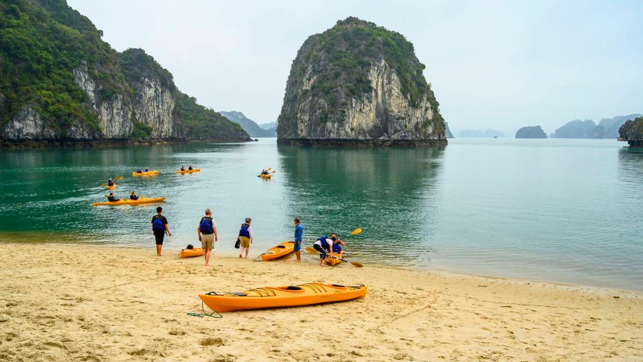 Despite The Rain, Halong Bay’s Warm Waters In July Are Great For Swimming And Kayaking