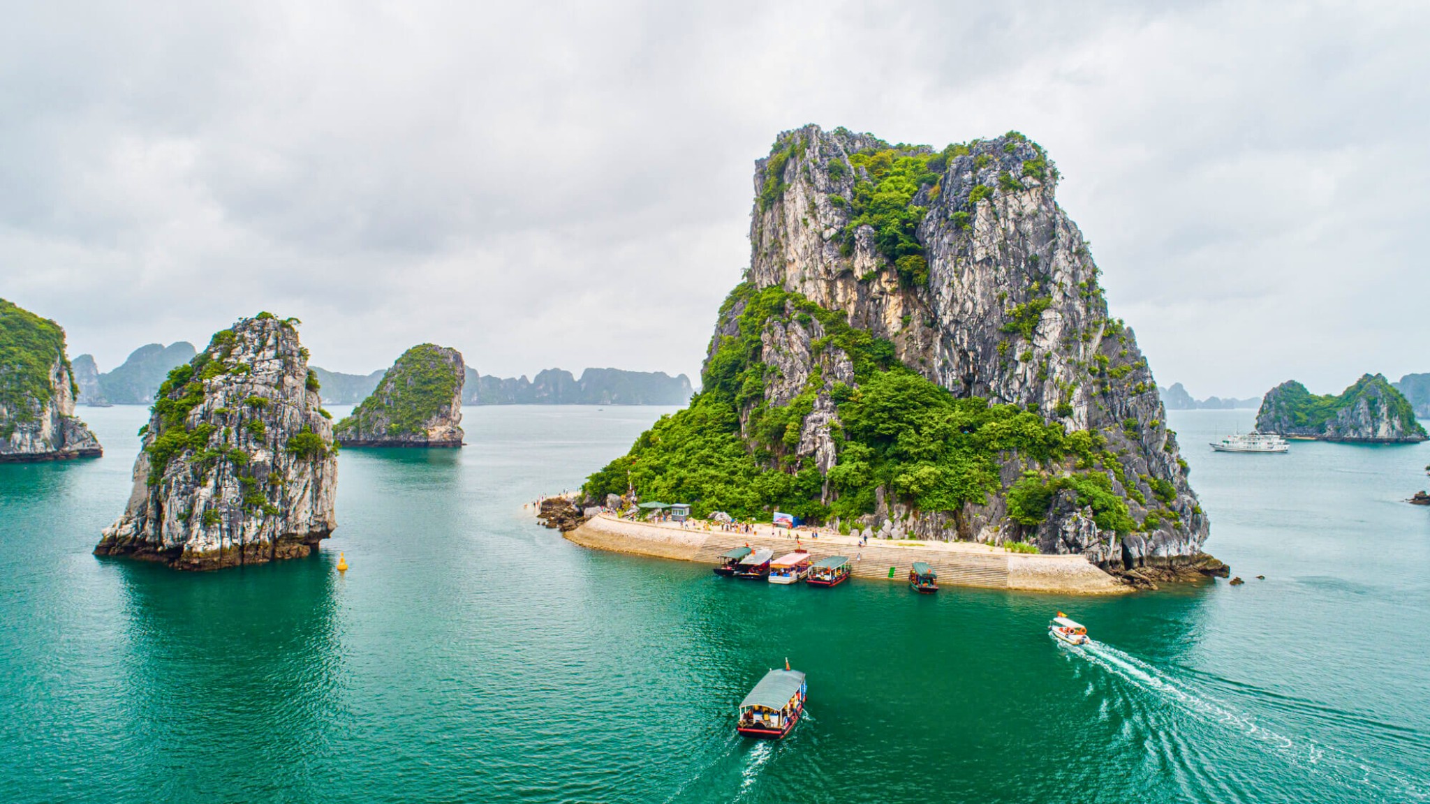 Titop Island Is Known For Its White Sand Crescent Beach And A Short Steep Hike To A Panoramic View Of Halong Bay
