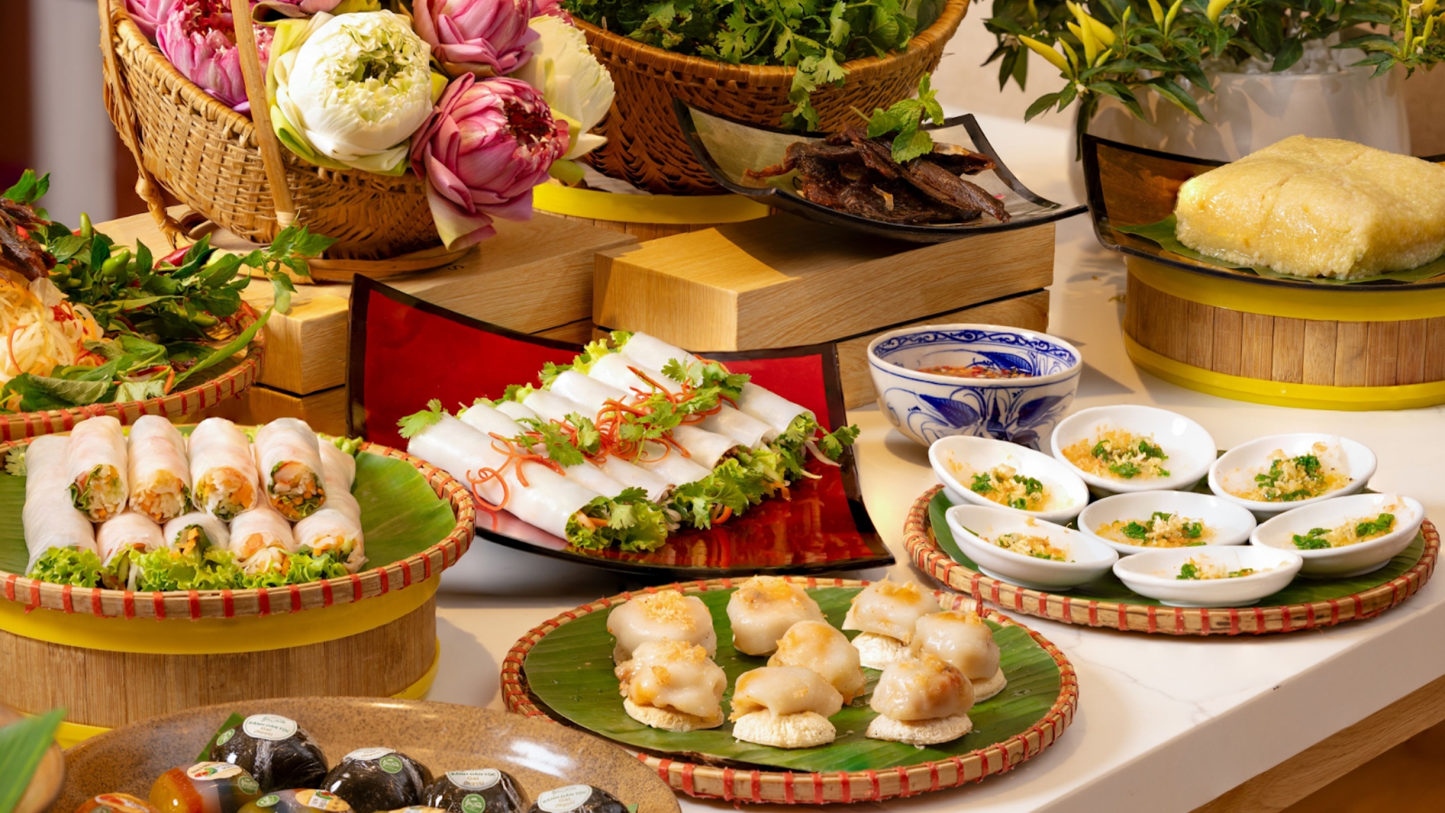 A Colorful Display Of Traditional Vietnamese Spring Rolls With Herbs And Dipping Sauces At Oven D'or