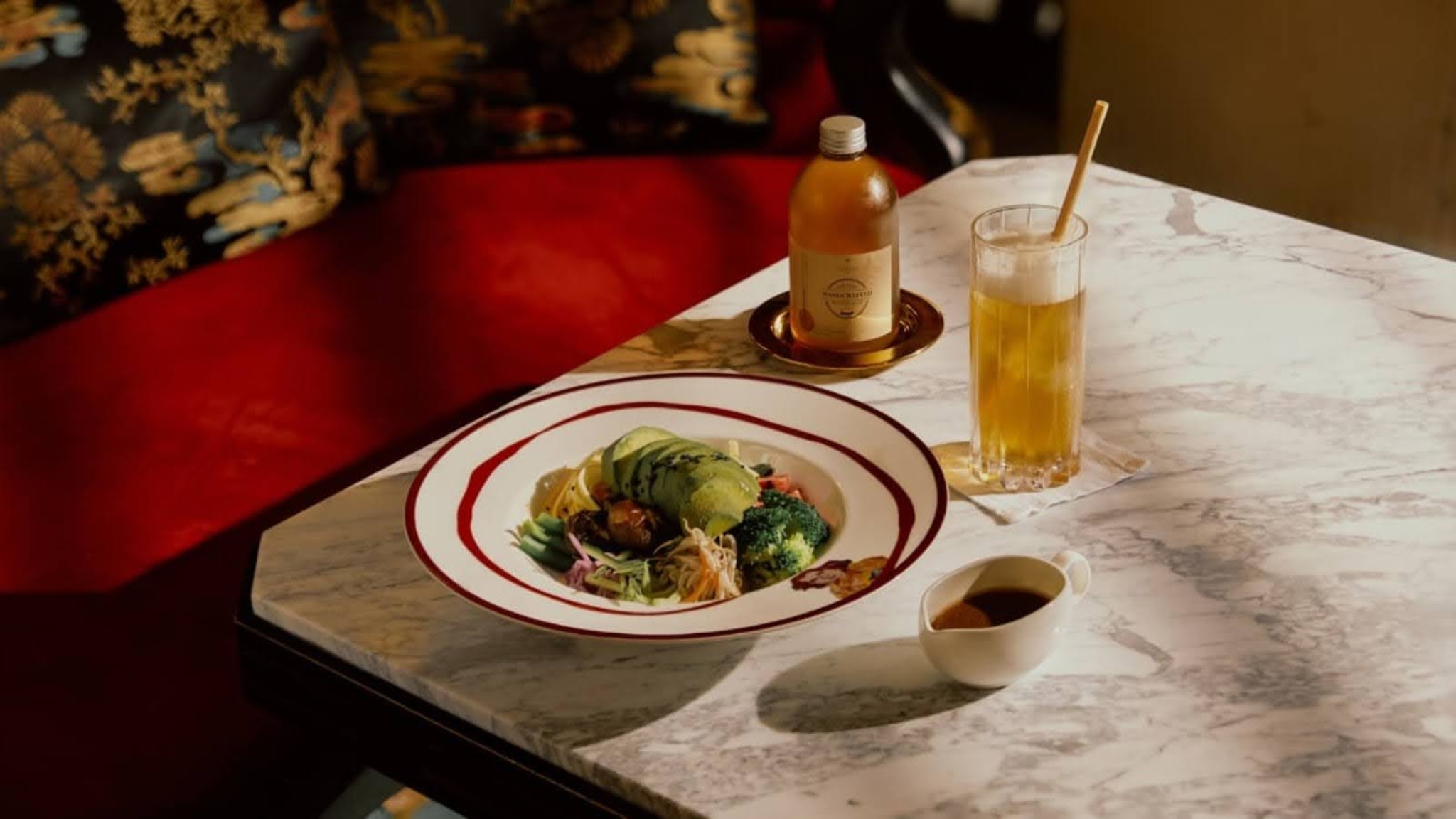 A Refined Meal With Bottled Tea And Well Served Plate At Diva's Lounge