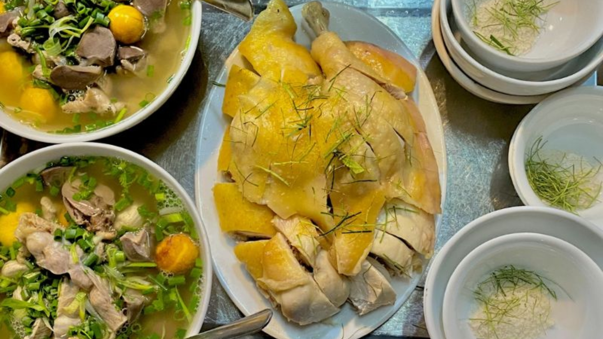 A Comforting Bowl Of Chicken Noodle Soup With A Plate Of Poached Chicken