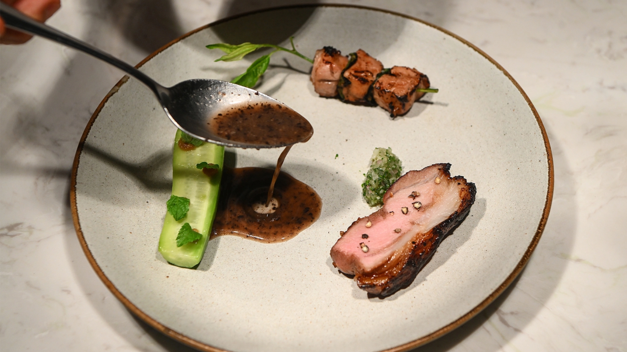 Grilled Black Pork Served With Cucumber And Special Sauce At Lamai Garden