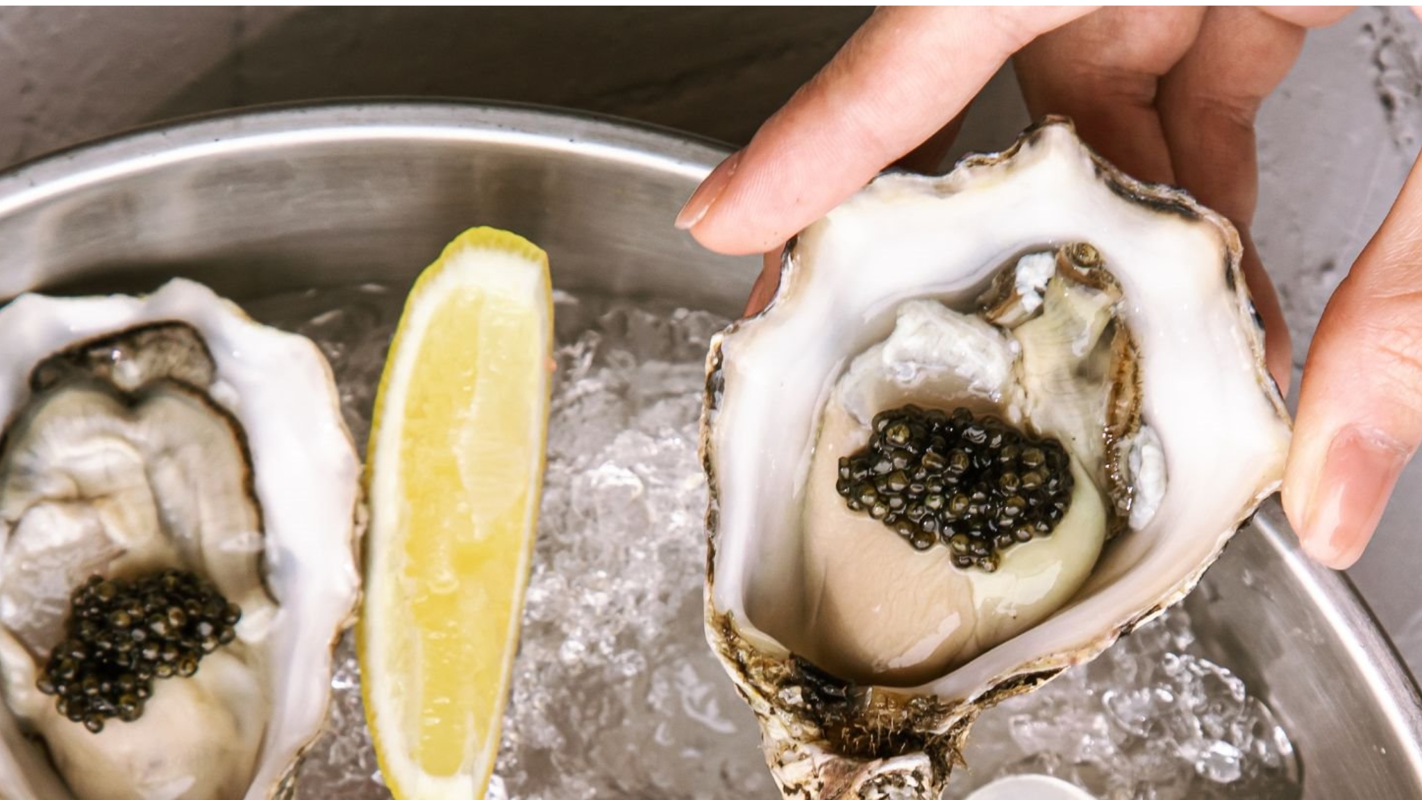 Fresh Oysters Topped With Luxurious Black Caviar At French Grill