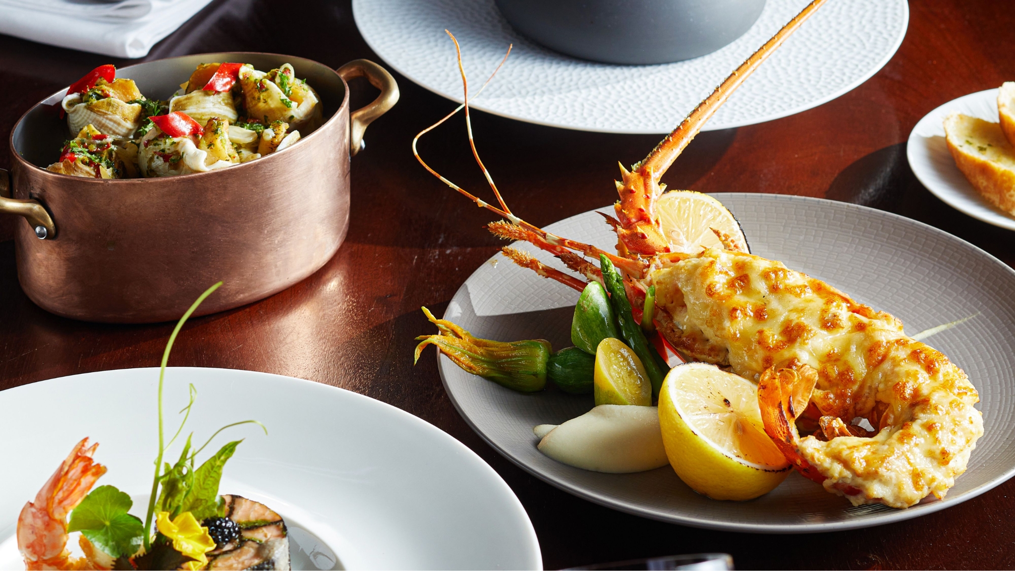 Grilled Lobster Paired With Vegetables And Citrus Twist Hemispheres At Steak & Seafood Grill