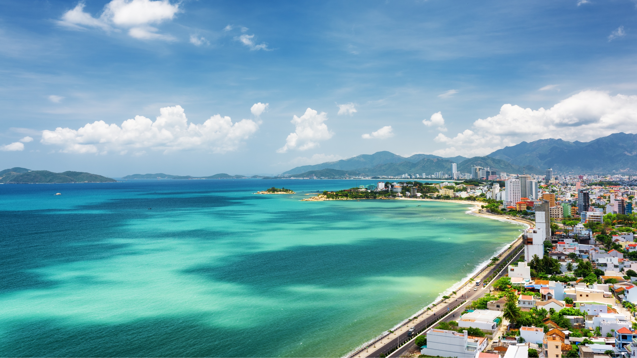Aerial View Of Tran Phu Beach With Calm Water And Crowded City Nearby