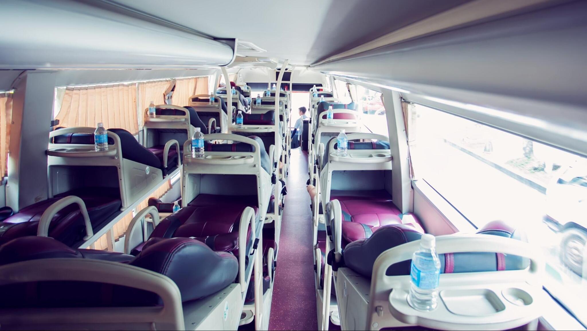 The bus interior is fully equipped with comfortable seats and air conditioning