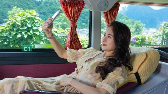 Passenger Relaxing On The Sleeper Bus