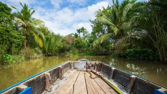 Immerse In The Peaceful Scenery While Gliding Through Narrow Canals