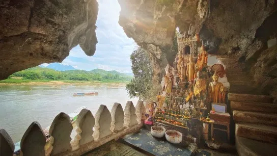 Day 8 Discover Pak Ou Caves Carved Into A Towering Limestone Cliff
