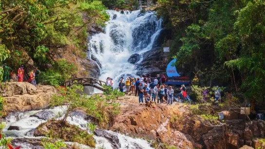 Day 3 Stop By Da Lat Waterfalls Surrounded By Verdant Forests And Rocky Cliffs