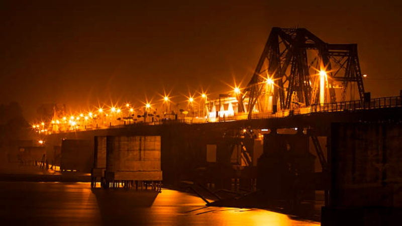 Pass Through The Ancient Long Bien Bridge At Night