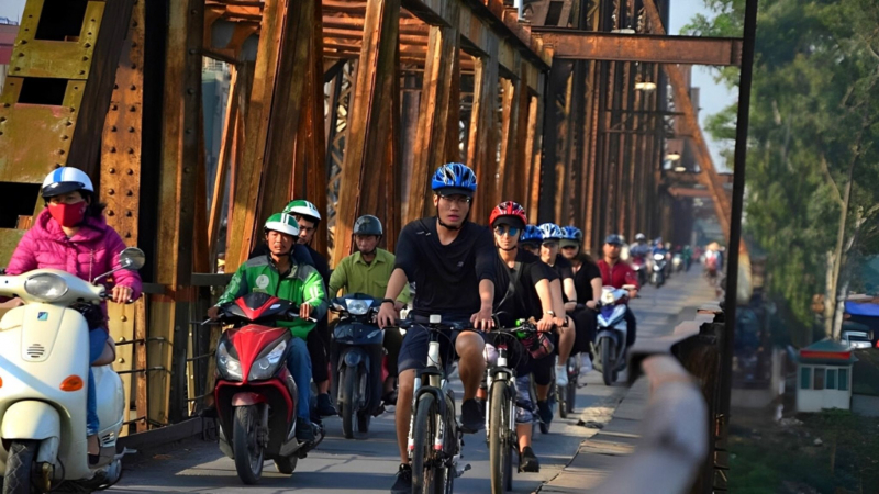 Cross The Red River Through Long Bien Bridge