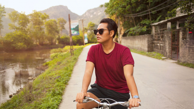 Cycle Over Meandering Roads While Seeing The Magnificent Rice Fields