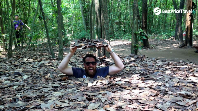 Visitor Is Cheerful When Discovering Cu Chi Tunnel