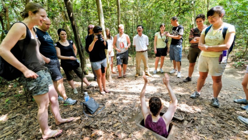 Challenge Yourself By Entering The Narrow Entrance Of Cu Chi Tunnels