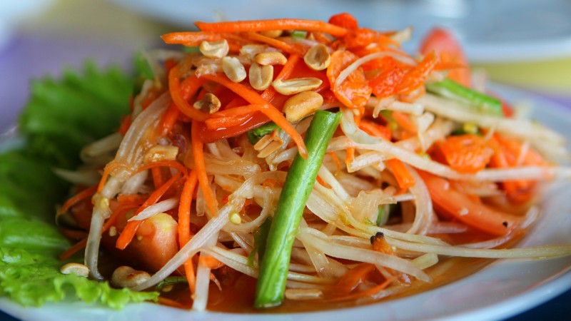 Create A Delicious Papaya Salad Mixing Sweet, Sour, And Spicy Tastes