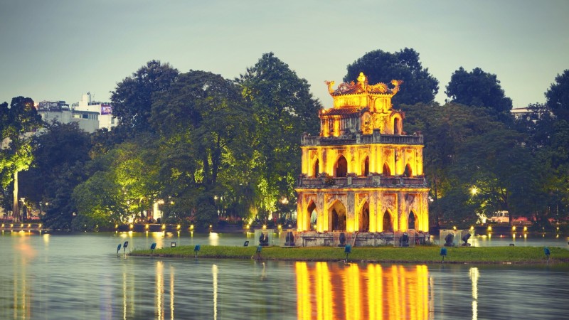 Ride Through Hanoi By Vespa Past Lively Streets And Hidden Corners