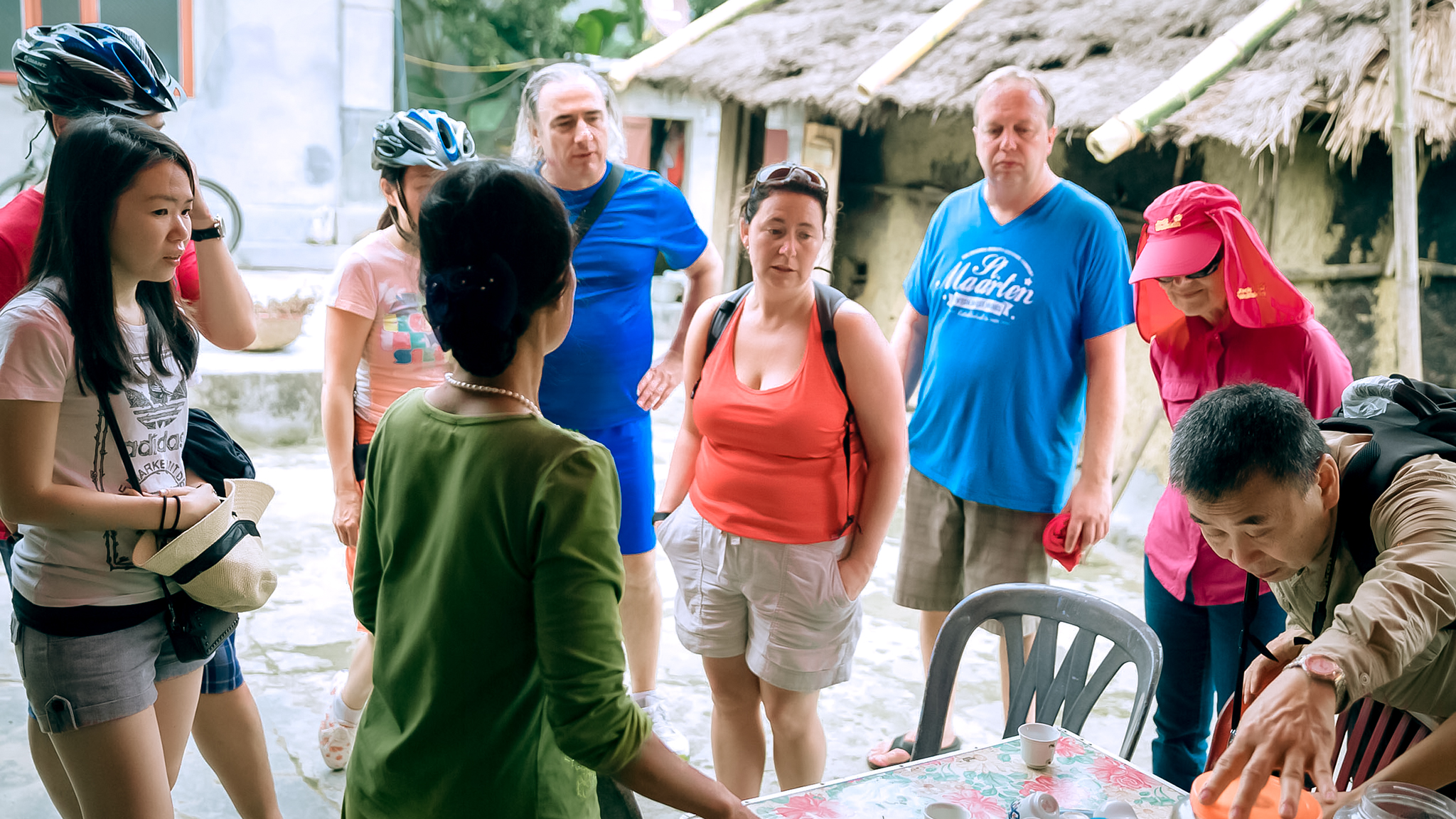 Guests visiting the ancient house in Viet Hai Village