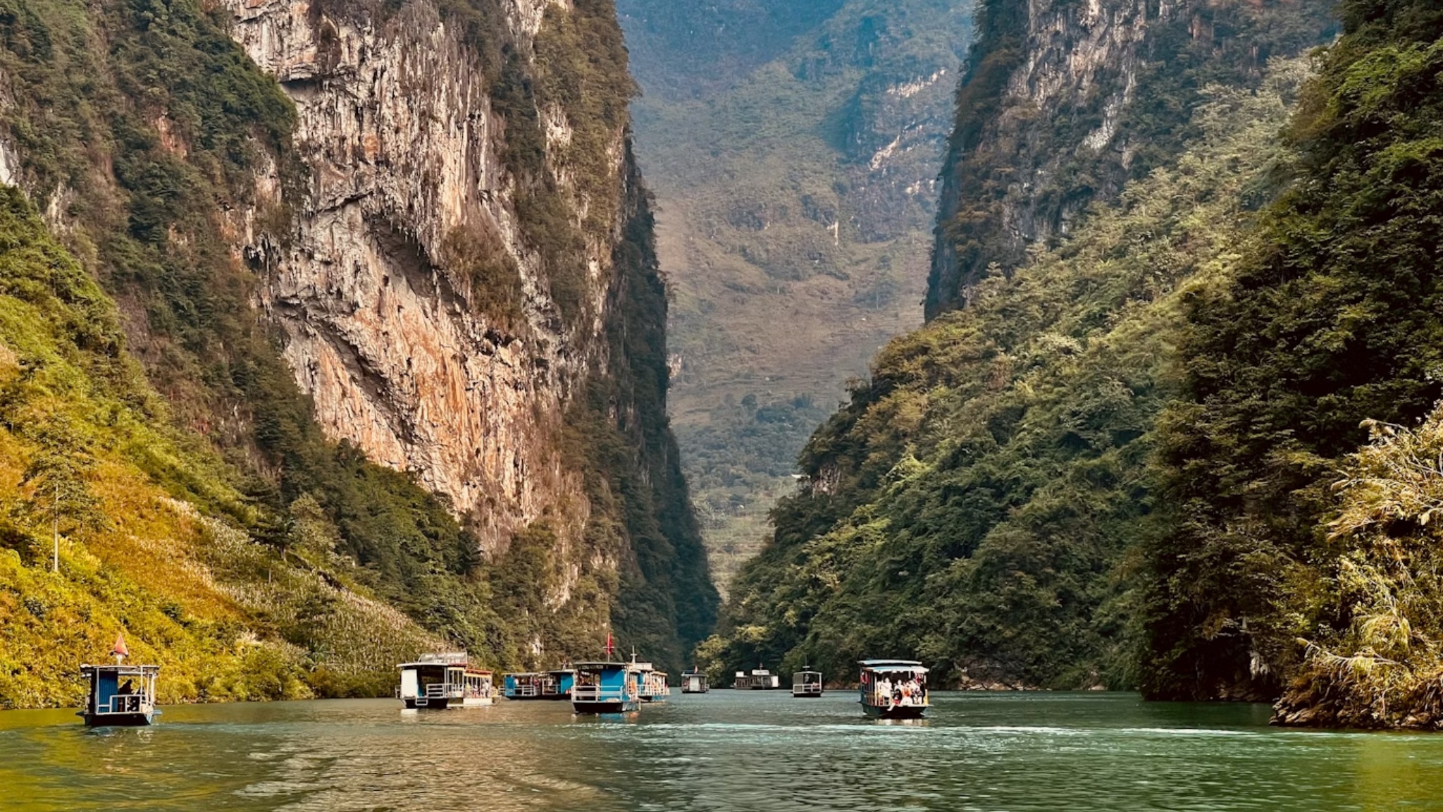 Day 7 Glide Gently Along The Nho Que River With Majestic Limestone Mountains Rising Above