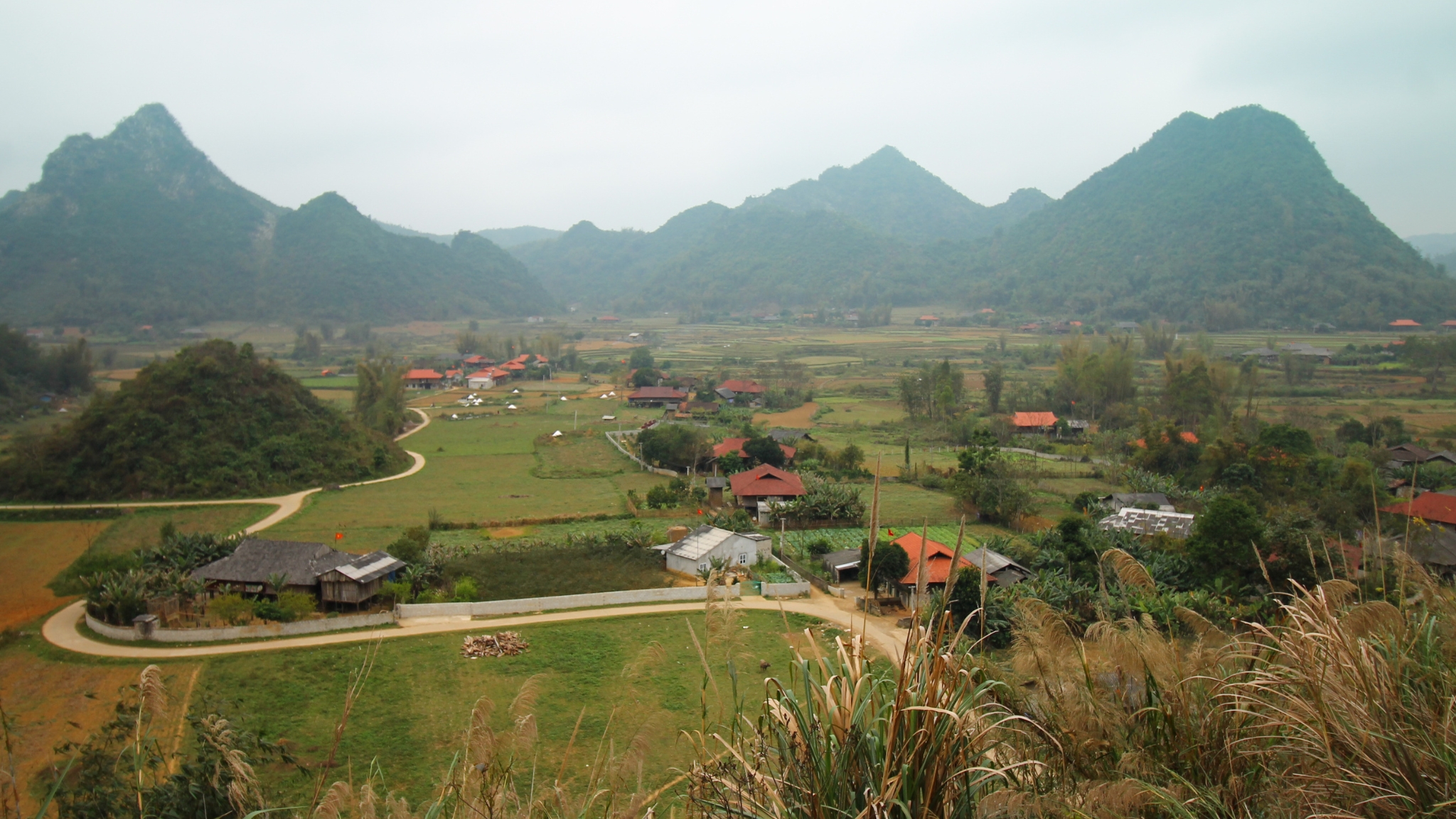 Day 9 Witness The Impressive Silhouette Of Mau Son Mountain Amid Vast Green Landscapes